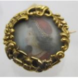 A yellow metal miniature brooch of a lad