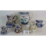 Six antique decorative jugs including th