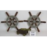 A pair of vintage ship's wheels construc