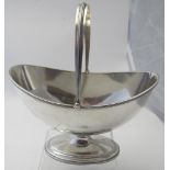 A silver sugar basket with swing handle,