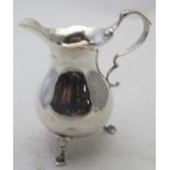 A silver cream jug in the Georgian style