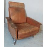 A mid century reclining armchair upholst