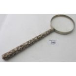 A large white metal magnifying glass. Th