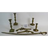 Two pairs of brass candlesticks, a pair