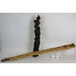 A Balinese carved hardwood staff with el