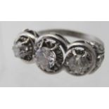 A white metal three stone diamond ring w