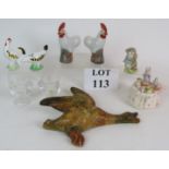 Two pairs of hand decorated ceramic chickens, a pair of glass egg cups, a 1950's plaster duck,