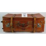 A large leather vintage style expanding suitcase with interior fittings expansion straps and