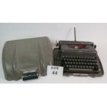 An early 1950's Imperial Good Companion 3 portable typewriter in original fibreglass case.
