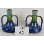 A pair of early 20th Century lobe handled drip glaze vases,