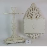 A white painted cast iron hall stick stand with wheat ear design and removable drip tray and a