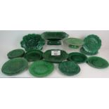 A collection of antique green Majolica ware plates and comports with moulded designs including