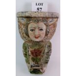 A large decorative carved wood corbel or bracket in the form of a Rococo Cherub with glass eyes and