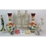 A pair of antique Parian ware figurines, a pair of large bottle vases, two NAO figurines,