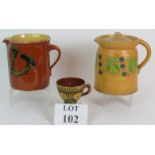 Two antique decorated Slipware dairy jugs,