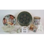 A selection of mixed ceramics including an Iznik style charger, a tobacco jar,