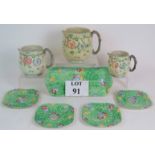 A graduated set of three relief moulded Beswick Ware jugs with sweet pea and trellis decoration