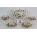 An early 19th Century hand decorated tea set with floral decoration probably Continental comprising