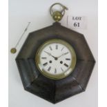 A late 19th Century fob style striking wall clock in patinated steel octagonal case with brass ball