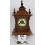 Early 20th Century Junghans striking mantel clock in ornate mahogany case.