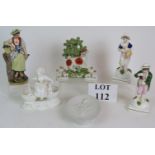 A Staffordshire lamb figurine two miniature lamb figures, three hand painted porcelain figures,