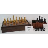 An antique inlaid rosewood chess and backgammon board with a full set of turned boxwood and Ebony