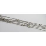 A fine 18ct white gold three strand fine