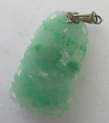 A carved jade pendant in the form of a h - Image 2 of 2