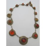 A fine amber mounted white metal necklac