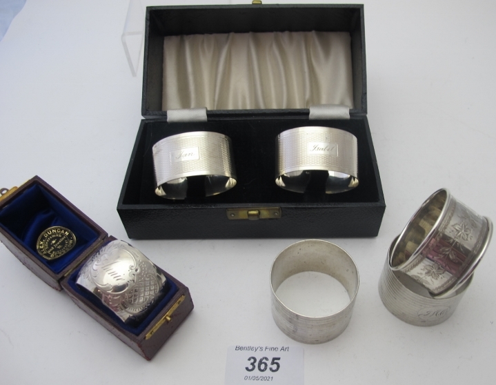 A collection of six silver napkin rings