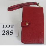 A Coach red grained leather smart phone