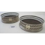 A pair of Georgian silver coasters with