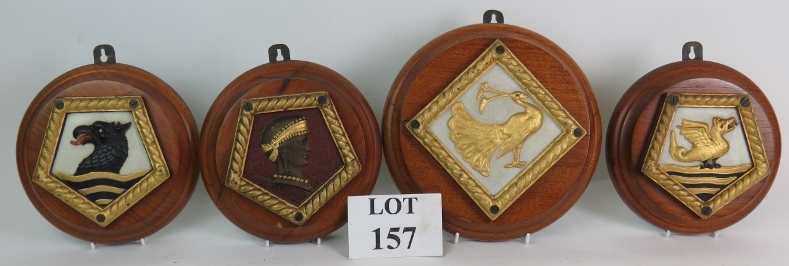 Four heavy cast iron naval ship's crest