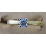 An 18ct gold single stone diamond set ri