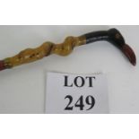 A vintage bird's head walking stick with