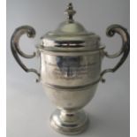 A two handled Irish silver trophy and li