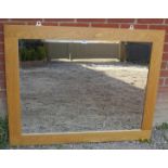 A large contemporary light oak framed be