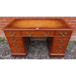 A late Victorian mahogany pedestal desk