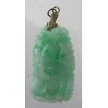A carved jade pendant in the form of a h