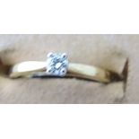 An 18ct gold single stone diamond set ri