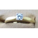 An 18ct gold single stone diamond set ri