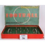 A vintage post war tin plate table football game with spring action players and steel ball bearing