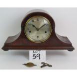 An early 20th Century German Napoleon mantle clock in mahogany case with chiming and striking