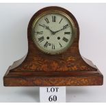 An in-laid Edwardian mantle clock in walnut case with painted dial. 30cm tall. No key or pendulum.