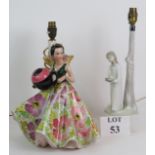 A vintage kitsch Italian pottery lamp base in the form of a lady with flowing floral dress.