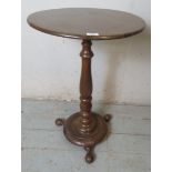 A turn of the century oak circular occasional wine table,