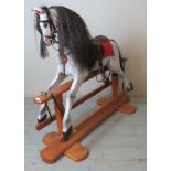 A good quality vintage rocking horse with real horsehair mane & tail, leather saddle & reins,