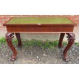 A Victorian mahogany library table with a tooled green leather inset surface,