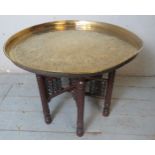 An Indian brass topped Benares style occasional/tea table,