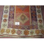 An early 20th Century hand woven Eastern possibly Moroccan rug with 3 diamond central panel on